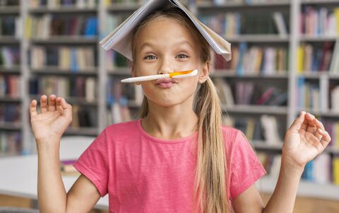 front-view-girl-being-silly-library